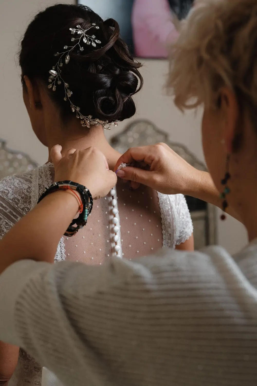 Bridal preparations detail — hair and dress captured with analog film warmth