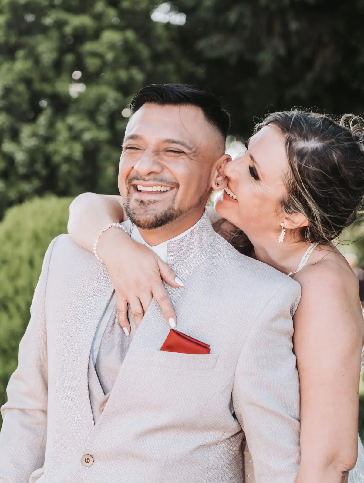 Wedding couple laughing together — portrait moment showing depth and expression