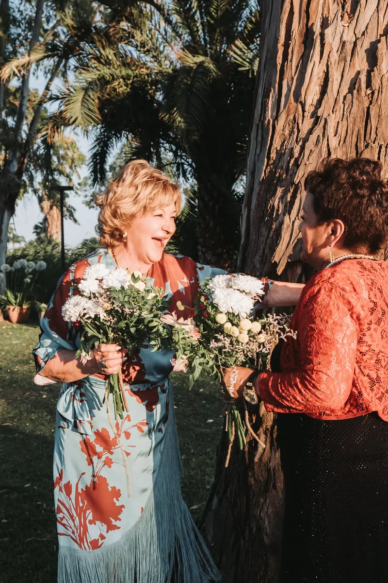 Wedding guests celebrating with flowers — legal guide for foreigners marrying in Spain